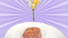 A plate of filet mignon and a martini against a colorful background.