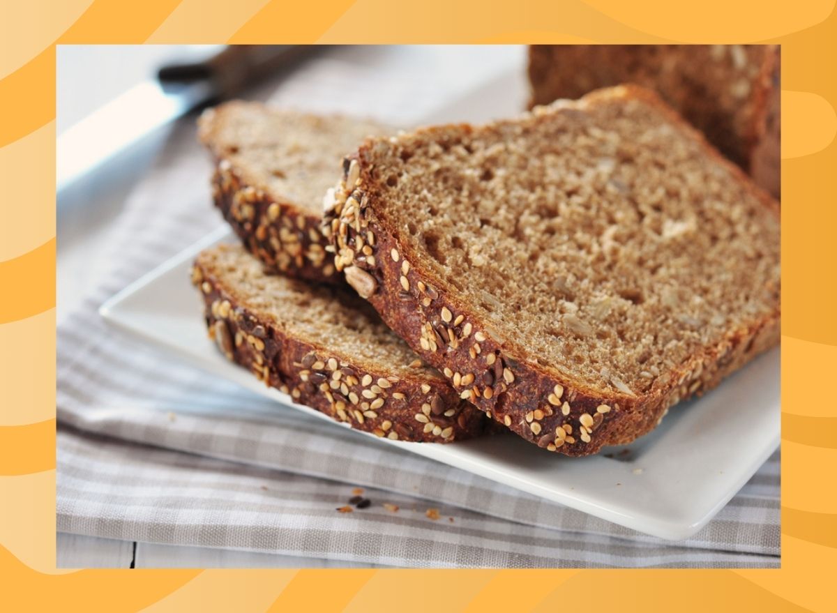 slices of whole wheat bread on an orange background