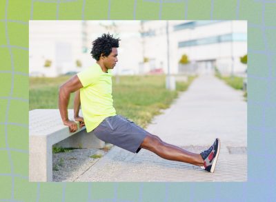 black man doing exercise dips outside on bench