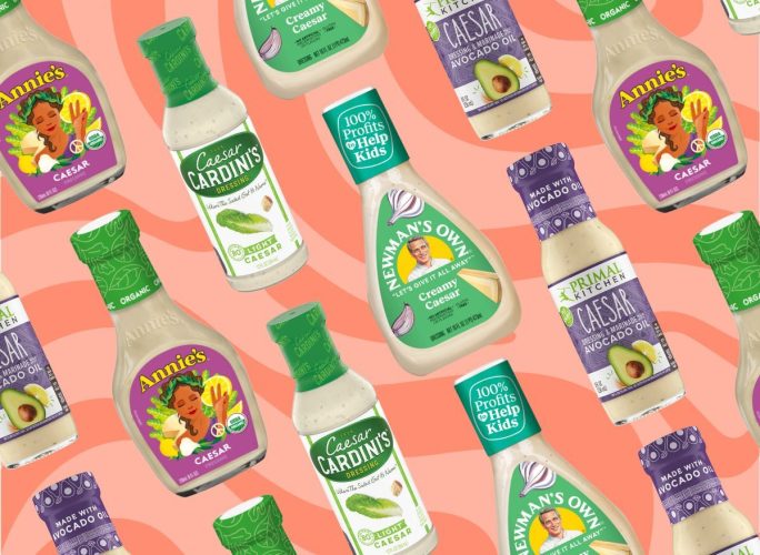 a collage featuring an assortment of bottled caesar salad dressings on a swirly pink background