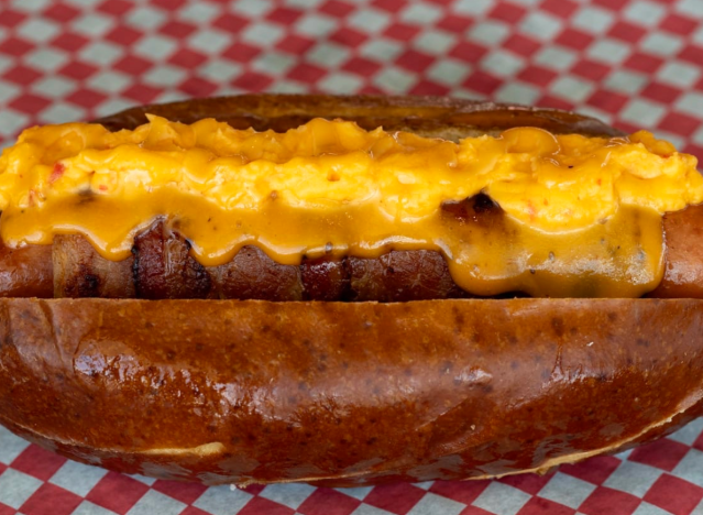 a brisket mac dog on a printed paper.