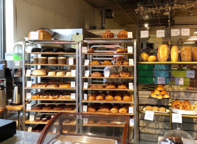 baked goods on racks at clear flour bread bakery.