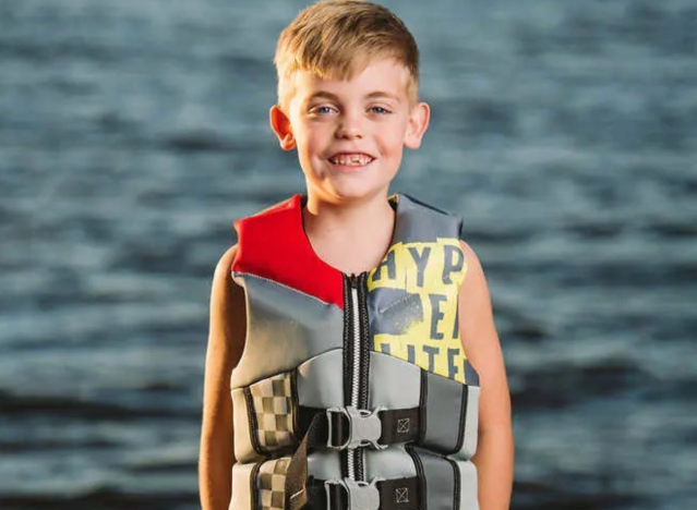 a boy in a life vest.