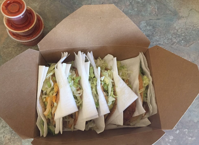tacos in a takeout box.