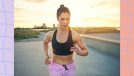 fit brunette woman in pink shorts and black sports bra running outdoors at sunset