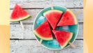 watermelon slices on picnic table and blue plate