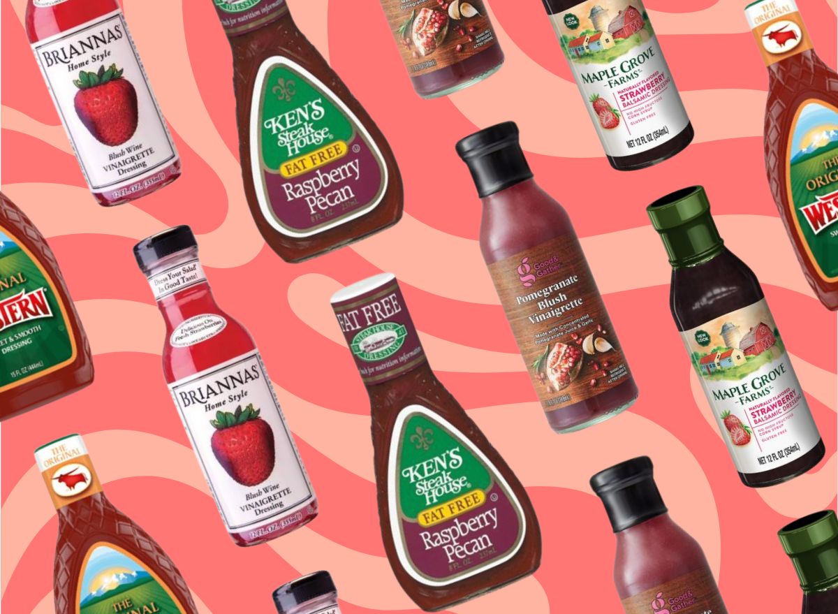 bottles of different salad dressings on a red and pink background