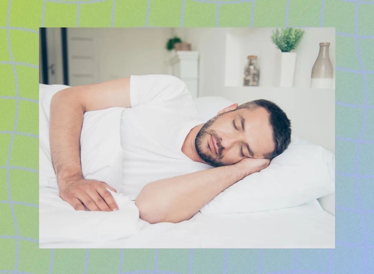 middle-aged man sleeping peacefully in bright room on bed with white sheets