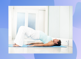 mature woman in yoga attire doing hip bridge in bright yoga room