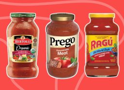 three jars of pasta sauce on a red background