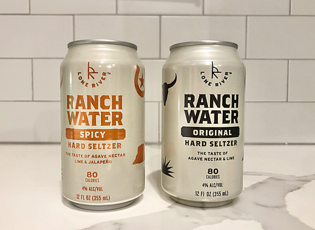 two cans of ranch water seltzer on a counter.