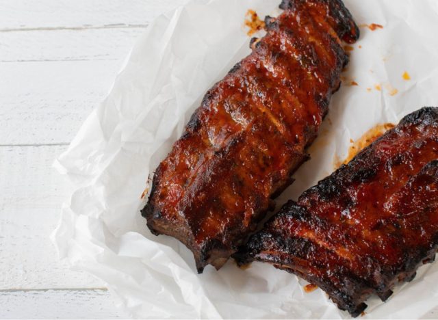ribs with barbecue sauce on a white table