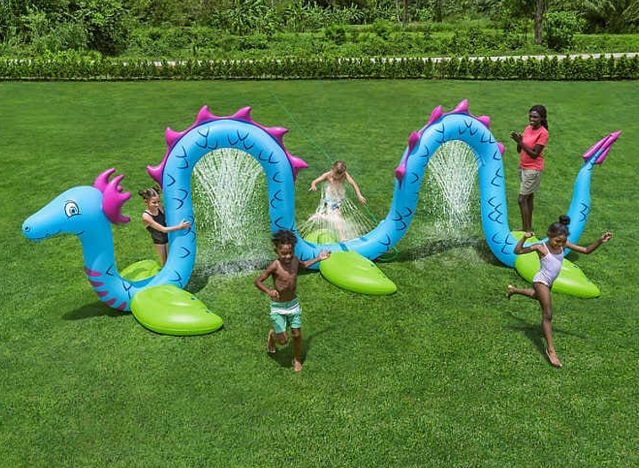 kids playing on a sea serpent water set.