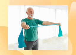 happy senior man doing resistance band exercise in bright workout room