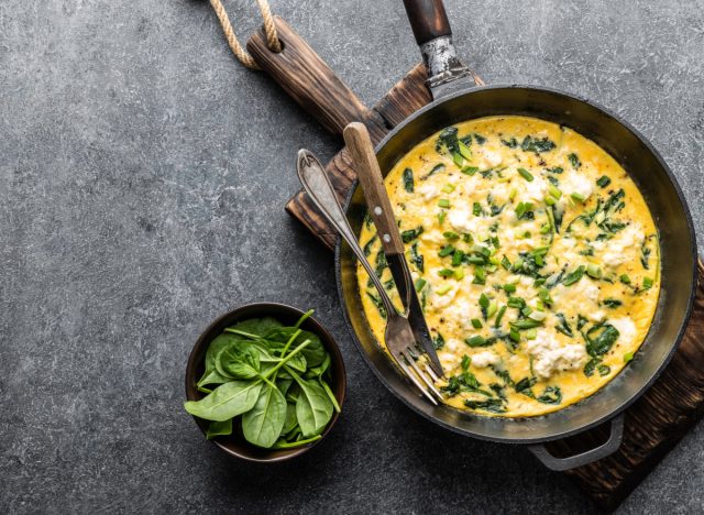 spinach feta omelet in skillet