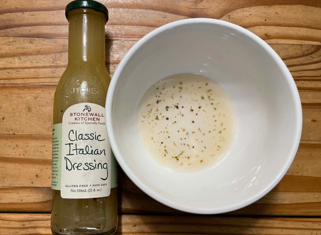 a bottle of stonewall kitchen dressing and a bowl beside it.