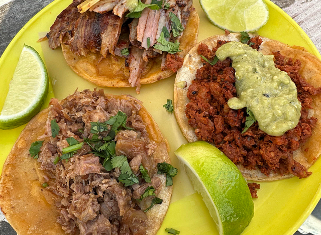 tacos on a yellow plate.