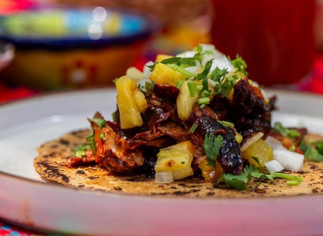 a loaded taco on a plate.