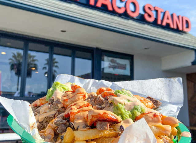 a taco dinner in front of the taco stand in san diego.