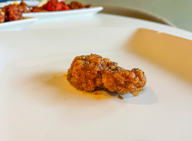 a chicken wing on a plate. 