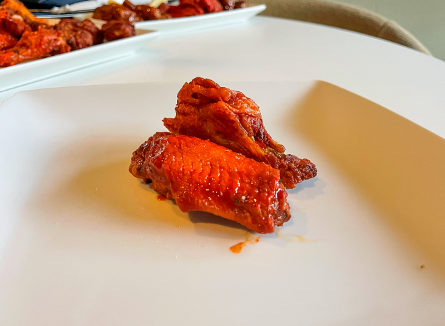 two mango habanero wings on a plate. 