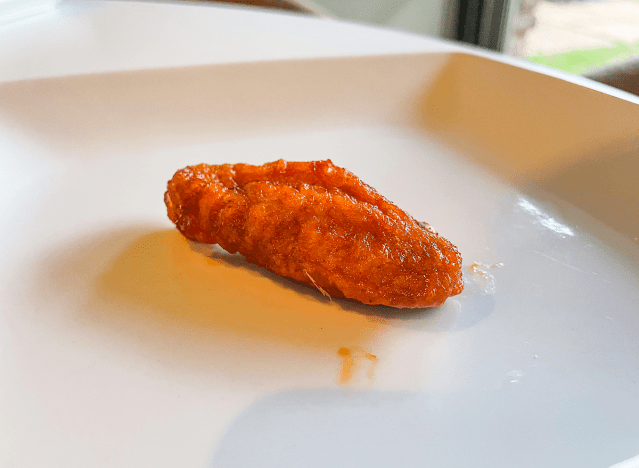 a hot wing on a plate.