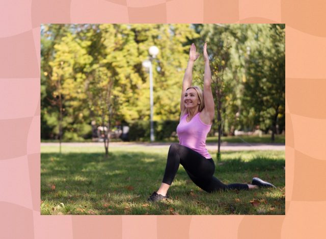 fit blonde woman in pink tank and black yoga leggings doing yoga pose in park on sunny day