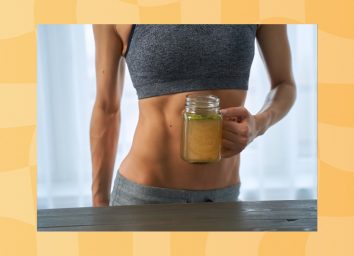 close-up of fit woman holding a mug of bone broth in kitchen