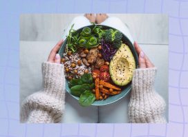 close-up of woman's hands holding healthy bowl of veggies and rice