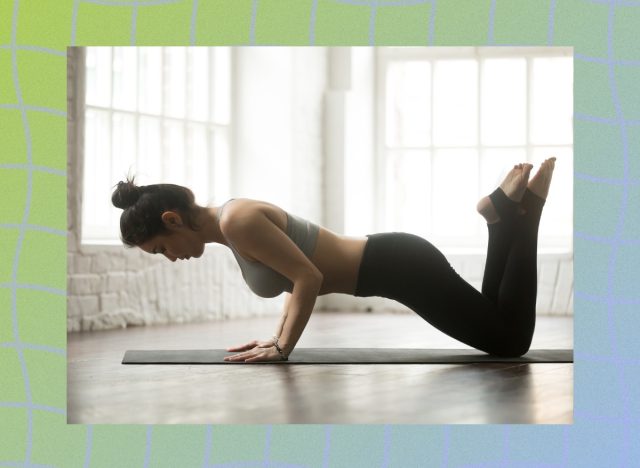 woman doing knee pushups on yoga mat in bright room surrounded by windows