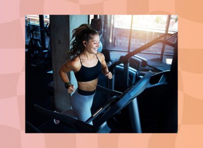 fit brunette woman running on treadmill at the gym