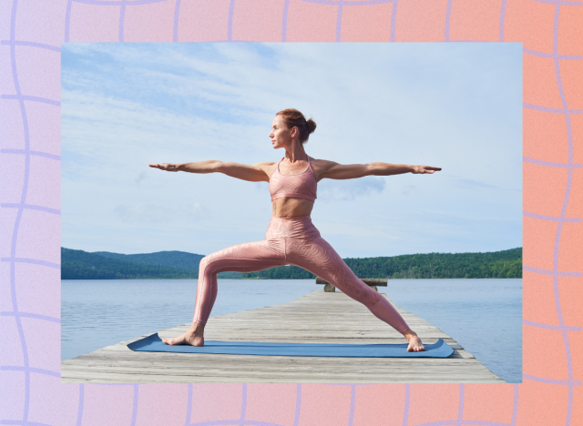 fit woman doing warrior yoga poses on dock by lake on sunny day