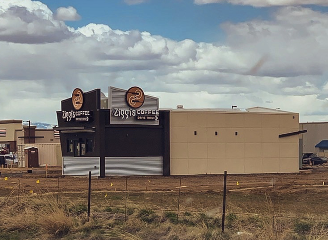 a ziggi's coffee shop under construction being built.