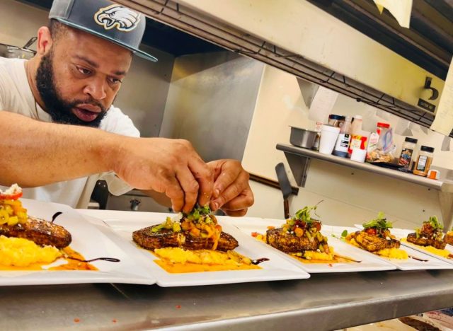 Steaks being plated by Chef Lynell Blanding at Mill Pond Steakhouse in Rembert, S.C.