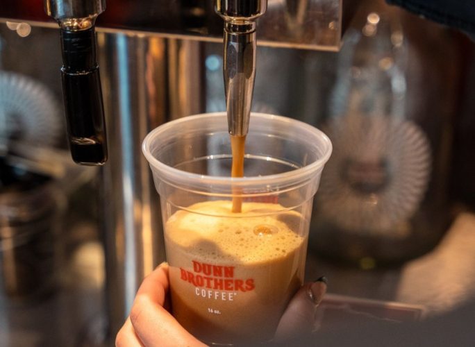 Dunn Brothers Coffee cup being filled with cold brew