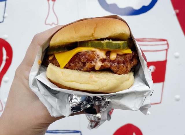 A fried chicken sandwich with cheese, pickles, and Rooster sauce from Philadelphia's Federal Donuts & Chicken