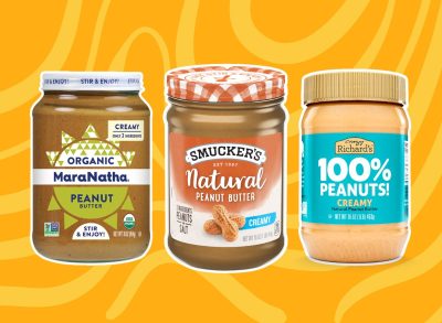 three jars of peanut butter on an orange background