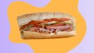 Half of an Italian sub sandwich on a colorful graphic background