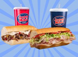 Two sub sandwiches from Jersey Mike's restaurant set against a colorful background