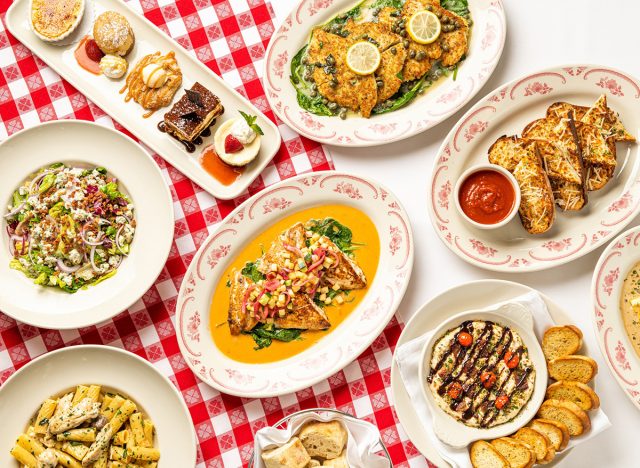 A family-style meal spread on a checkered tablecloth at Maggiano's restaurant