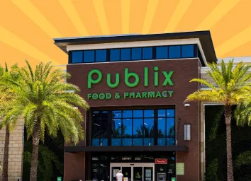 The storefront of a Publix supermarket set against a colorful background