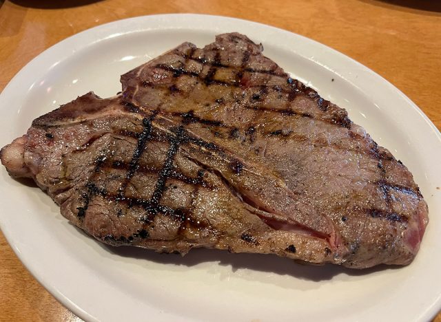 23-ounce T-Bone Porterhouse steak on a white plate at Texas Roadhouse