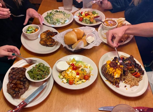 Texas Roadhouse table full of food