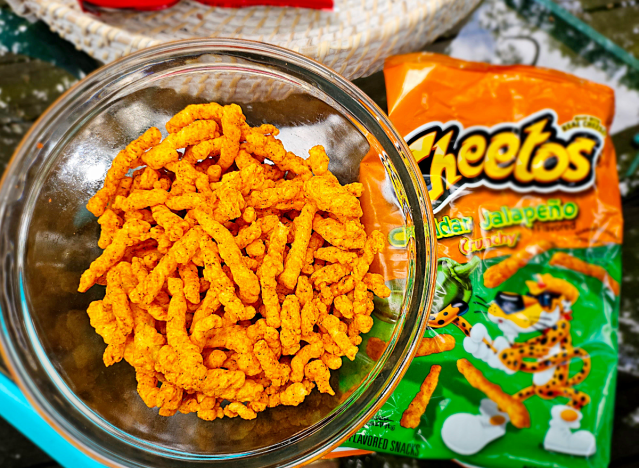 a bowl of cheetos cheddar jalapeno.