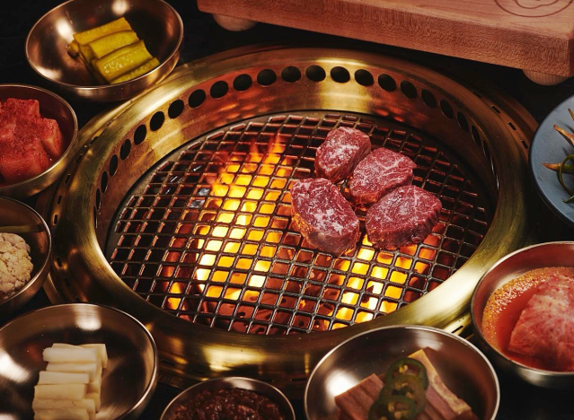 cote miami wagyu steaks over a grill