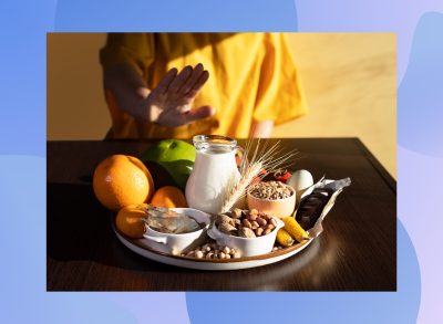 elimination diet concept, woman saying no to allergen foods on table