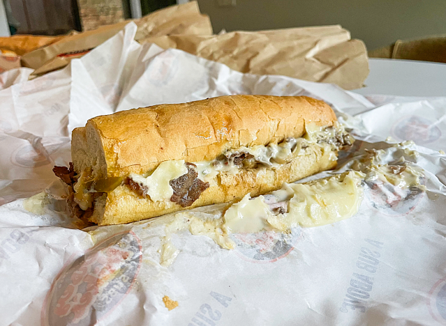 a jersey mike cheeseteak sub on a paper.