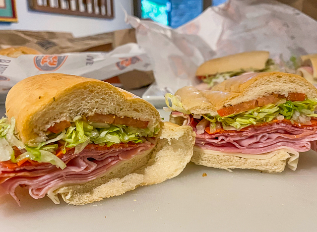 a jersey mike original italian sub cut in half on a wrapper.