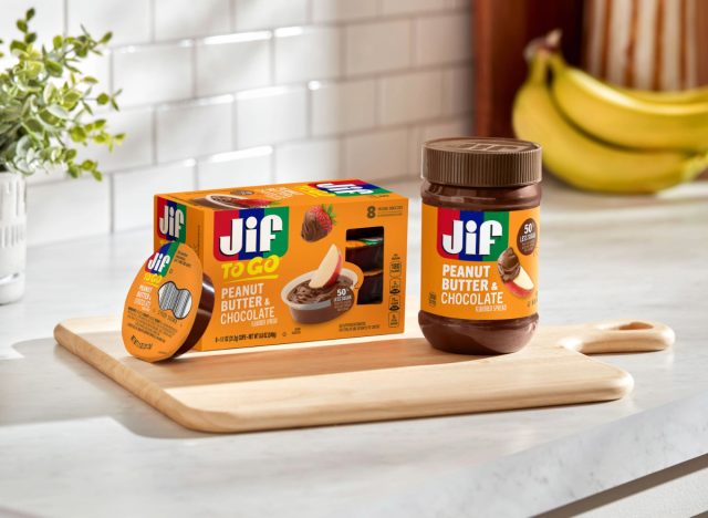 box of jif's peanut butter chocolate spread to-go next to a jar of jif's peanut butter chocolate spread