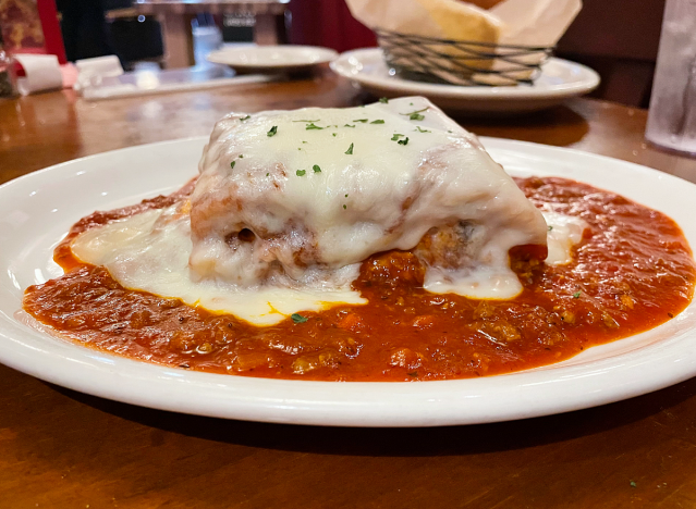 lasagna on a plate at johnny carino's restaurant. 